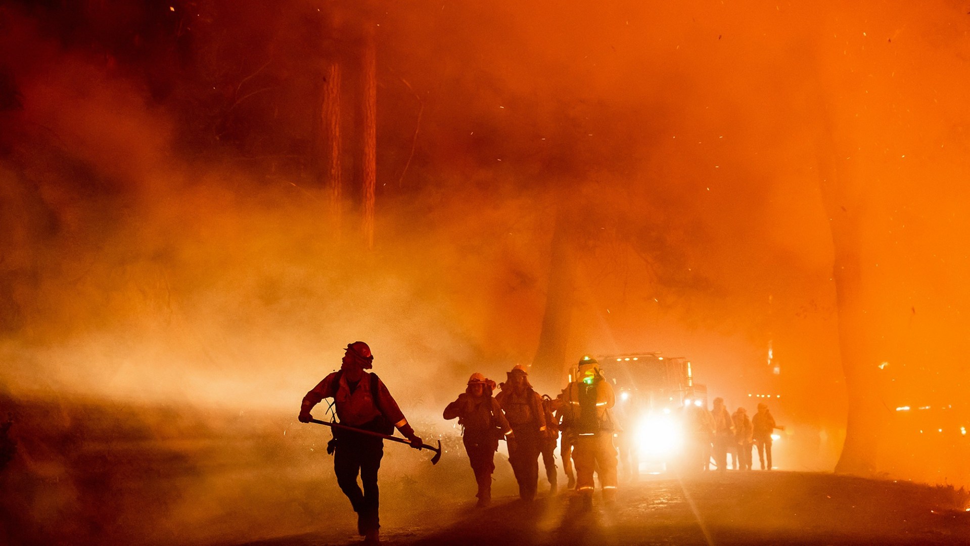 Firefighters battle the Mosquito Fire burning in unincorporated Placer County in 2022. Photo by Noah Berger, AP Photo