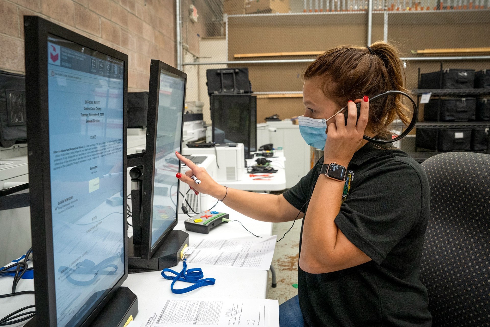 Alicia Little, an election services specialist, tests the logic and accuracy of an accessible voting machine called ICX at the Contra Costa County Elections Department on Sept. 30, 2022. Photo by Michaela Vatcheva for CalMatters